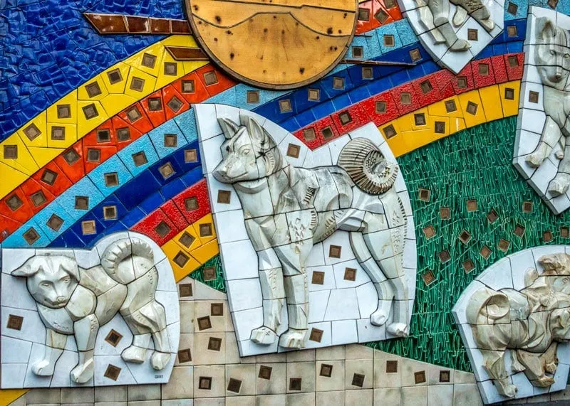 Hachiko's mosaic wall near statue at Shibuya Station in Tokyo