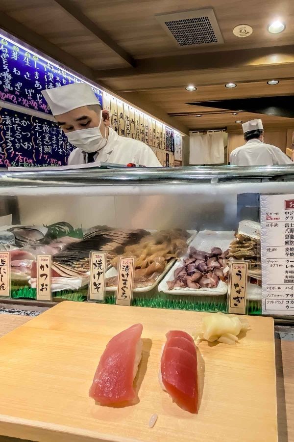 Two types of tuna nigiri sushi at standing sushi bar in Shibuy